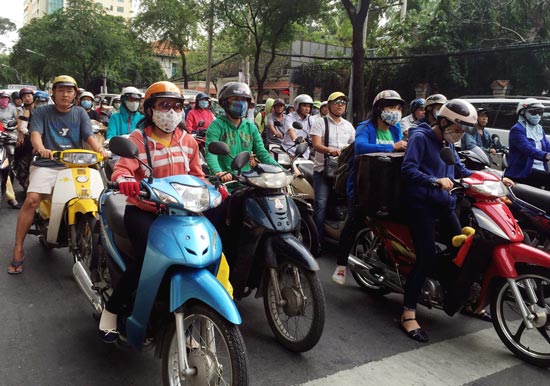 Overseas Vietnamese enjoy motor vehicle tax breaks, HCMC collects road maintenance fee on motorbikes, EU, Vietnam share experience on climate change response, Storm Vam Co lashes Quang Nam-Quang Ngai