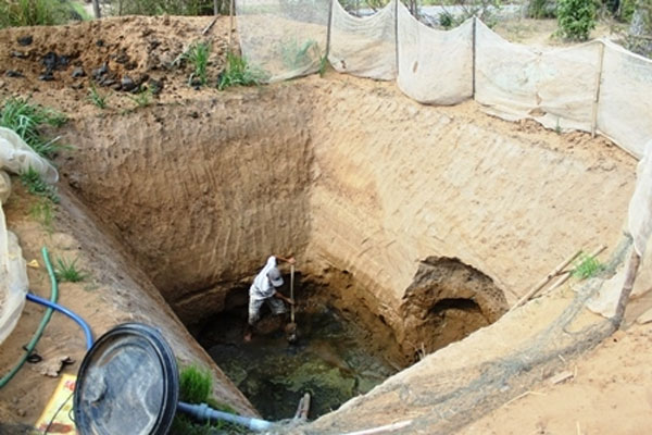 Farmers digging dangerous holes