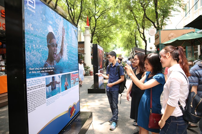 Photo exhibition opens in the city’s Book Street, entertainment events, entertainment news, entertainment activities, what’s on, Vietnam culture, Vietnam tradition, vn news, Vietnam beauty, news Vietnam, Vietnam news, Vietnam net news, vietnamnet news, vi